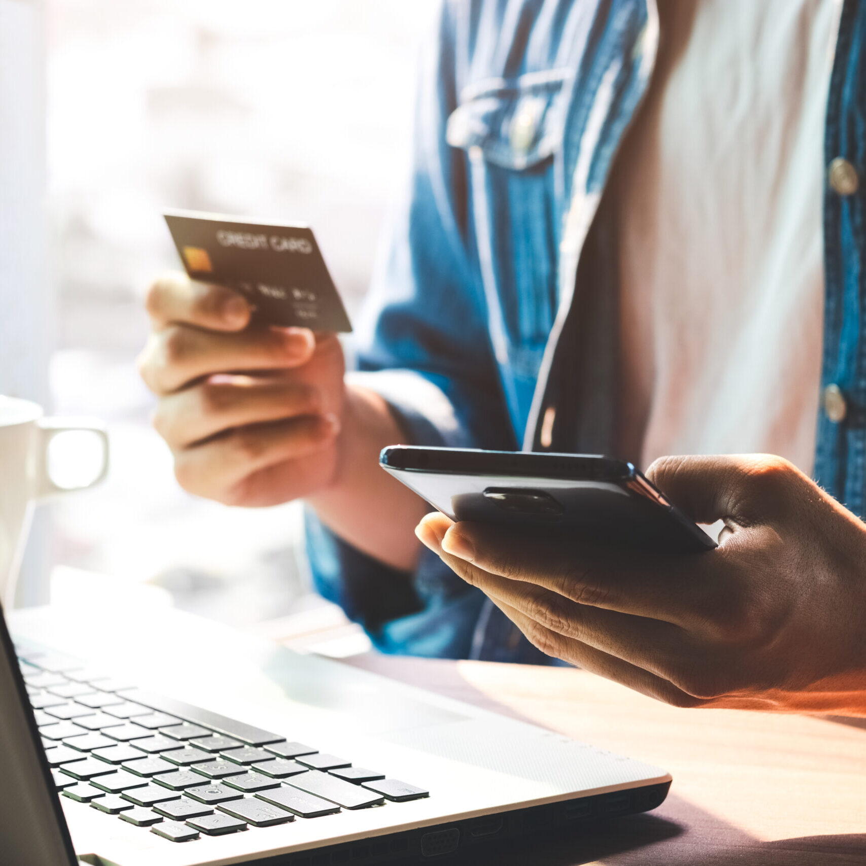 Men use their credit cards through mobile internet banking apps to shop online and digital payment ideas.